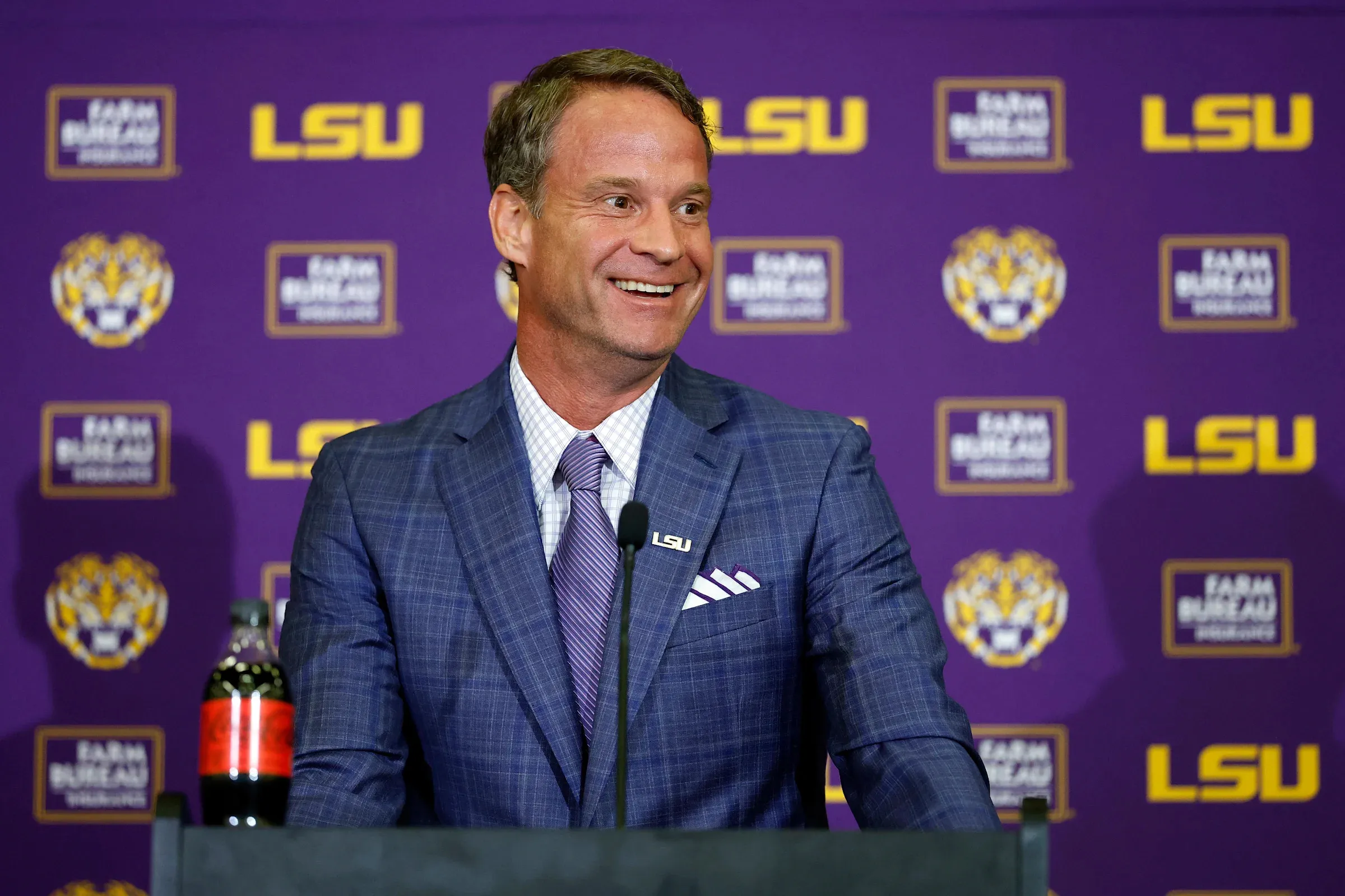 LSU enticed Lane Kiffin from Ole Miss with an airport hangar, pools of money and 'the best job in America'
