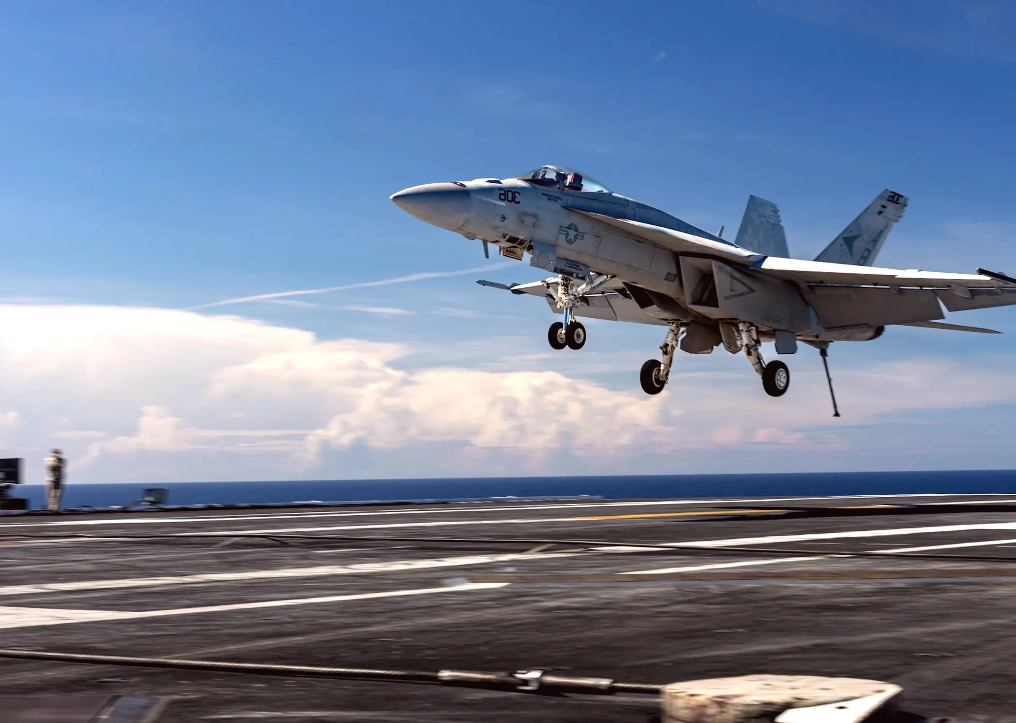 A Navy jet's $60 million aircraft carrier landing goes awry in seconds with a bang and sparks