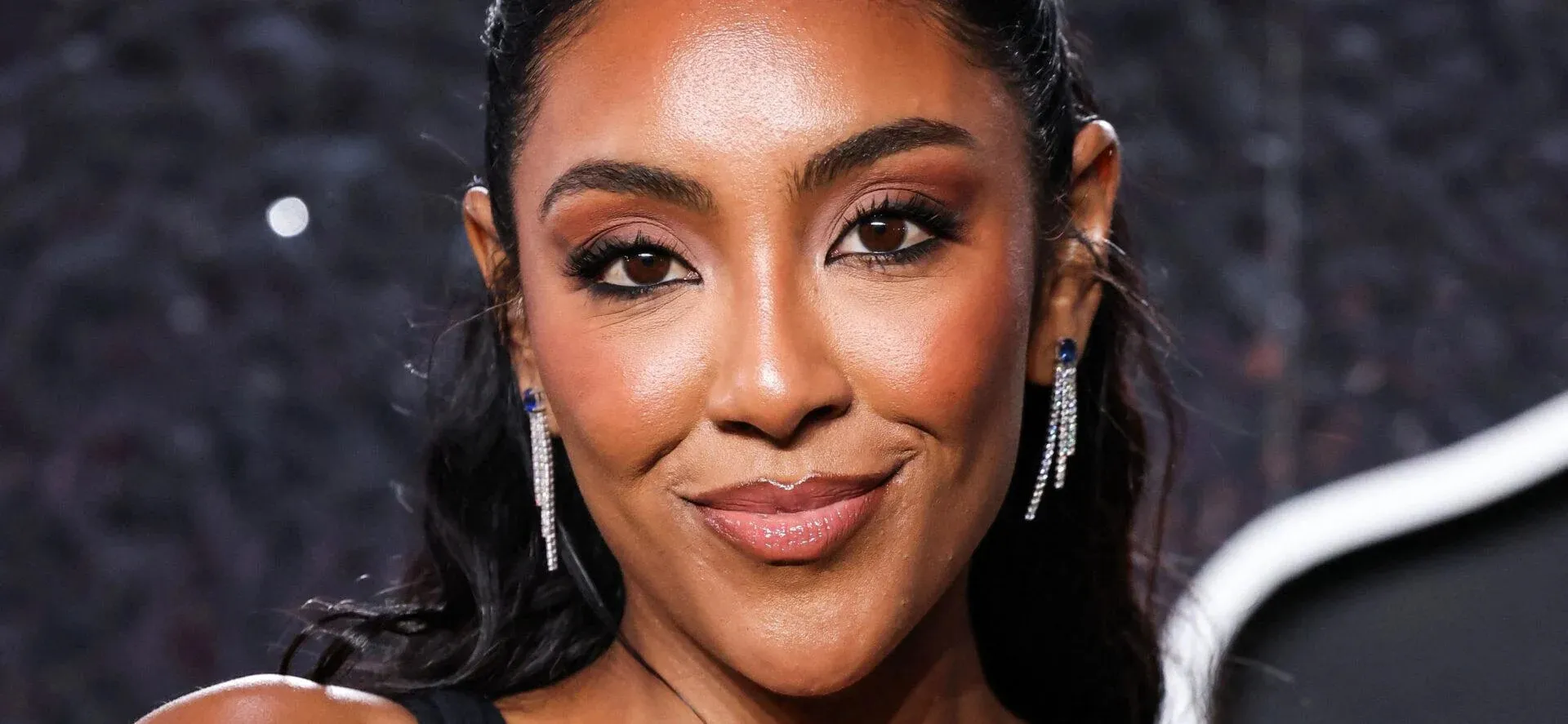 Tayshia Adams Evokes Emotions at Raising Cane's Holiday Bike Bash