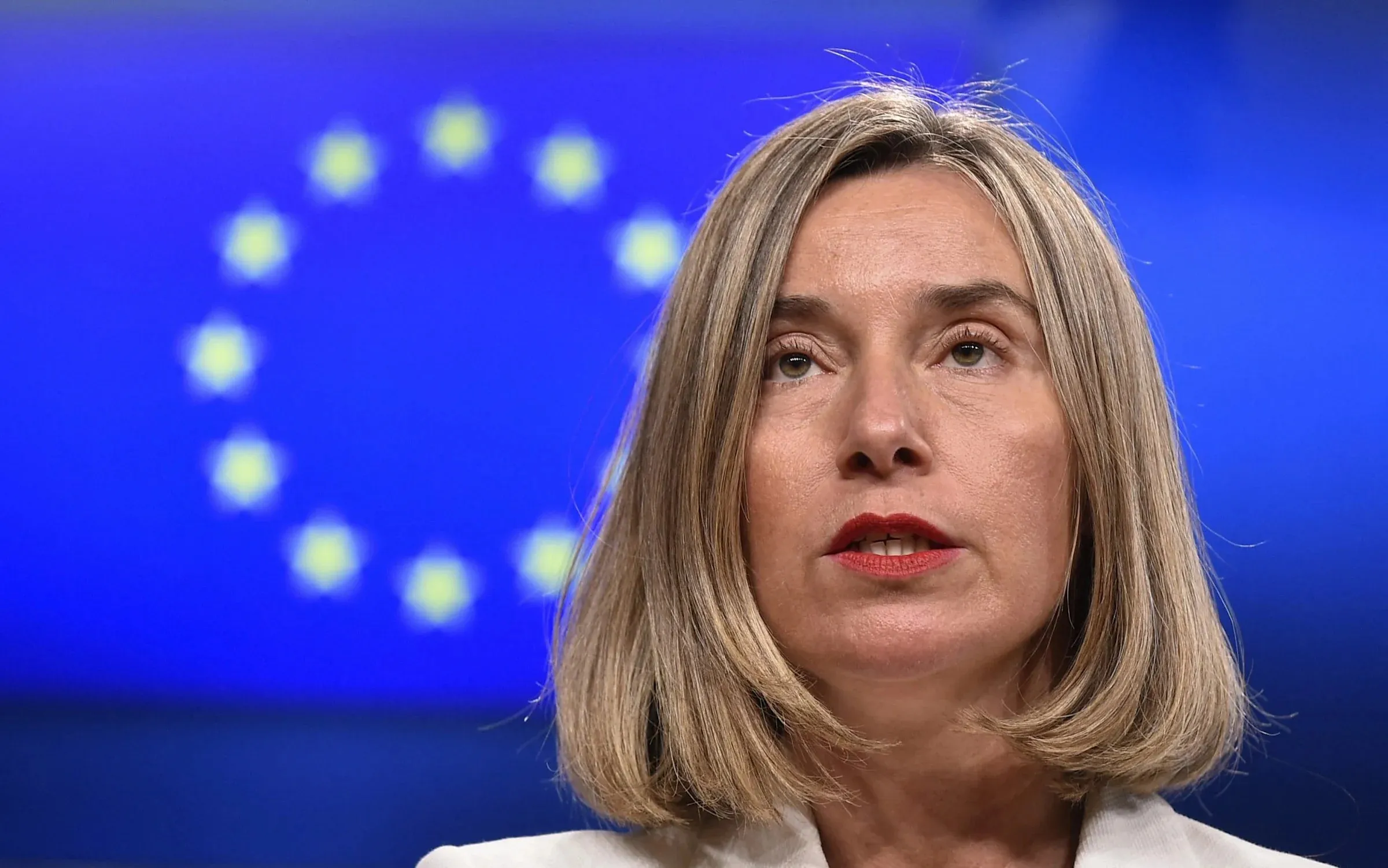 Three arrested in fraud raids, including former EU chief diplomat