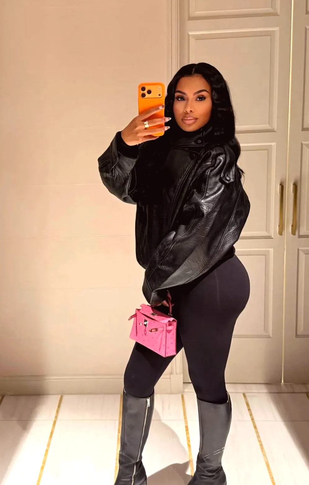 NBA WAG Alisah Chanel Washington Impresses in Black Leather and Leggings