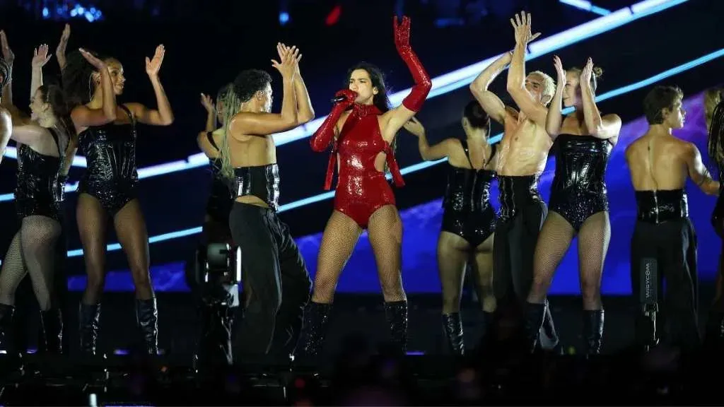 Dua Lipa's Red Bodysuit Secured Only by Belts