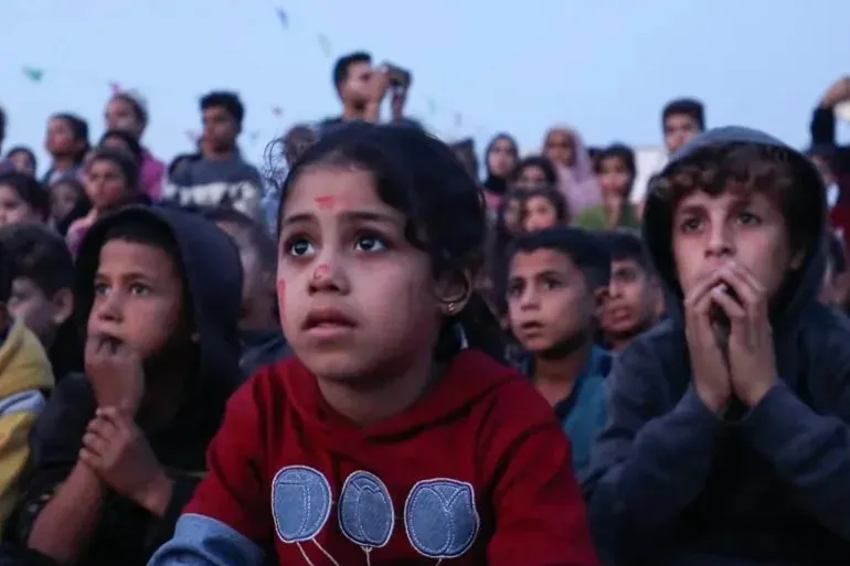 Impromptu film showings in Gaza City provide children with a break from devastation