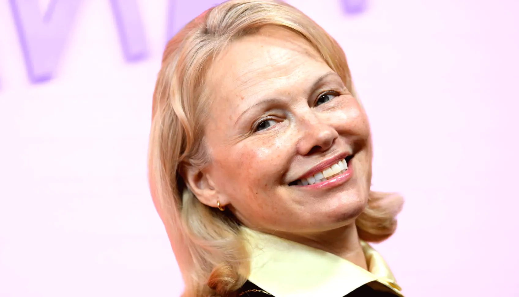 Get the look of Pamela Anderson's favorite cozy gray sweater starting at $34