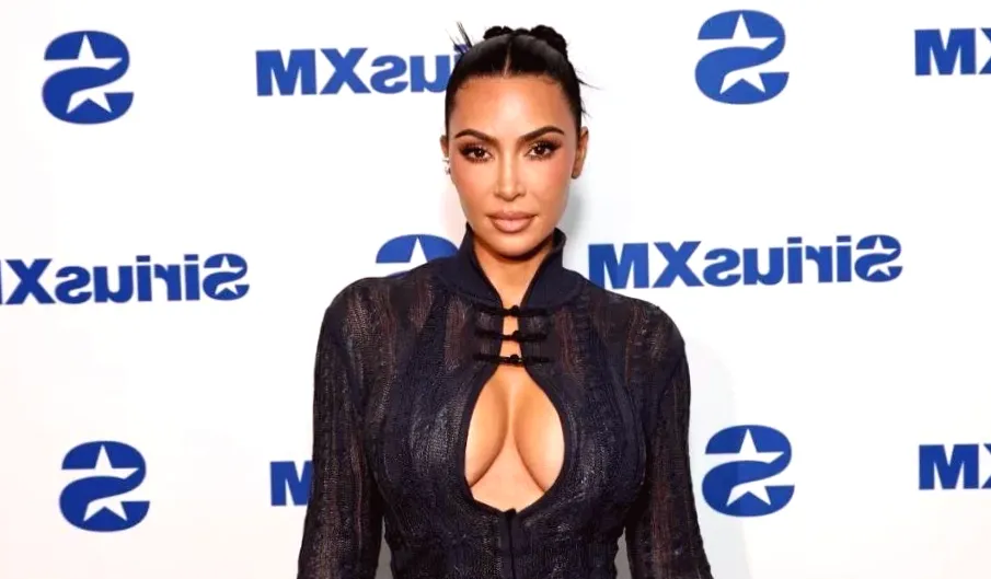Must See: Kim Kardashian Sitting in Mini-Dress
