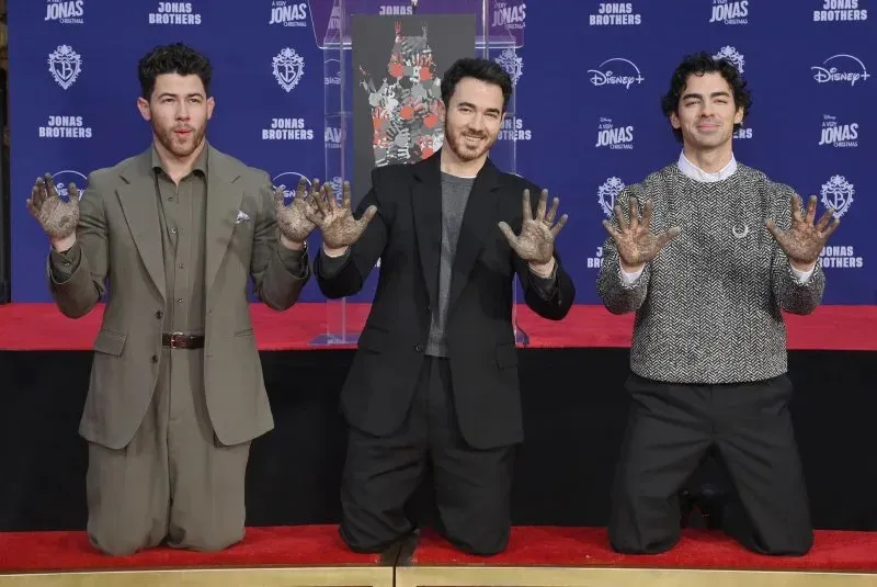 Jonas Brothers honored with hand and foot prints at TCL Chinese Theater