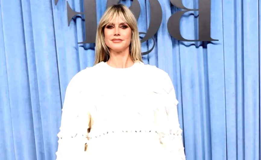 Heidi Klum Demonstrates Sheer Tights Are Compatible with the Smallest Miniskirts