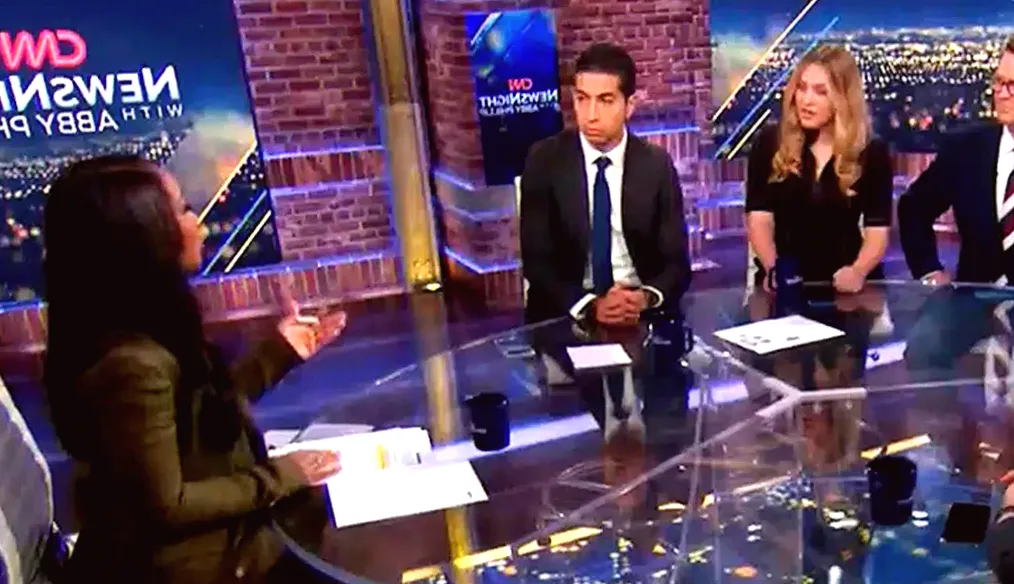 CNN Anchor Rebukes Trump Supporter For Laughing When Rioters Wore Anti-Semitic Messages