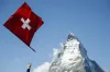 Swiss reject inheritance tax on ultra-wealthy; support female military service