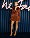 Lottie Tomlinson Shows Off Leggy Look in Brown Satin Mini Dress at the Fashion Awards 2025