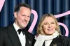 Kim Cattrall ties the knot with Russell Thomas in a bridal outfit designed by 'Sex and the City' costume designer, after almost a decade of dating.